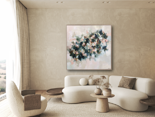 Modern living room with a white sofa, side chairs, and a abstract floral painting on the wall.