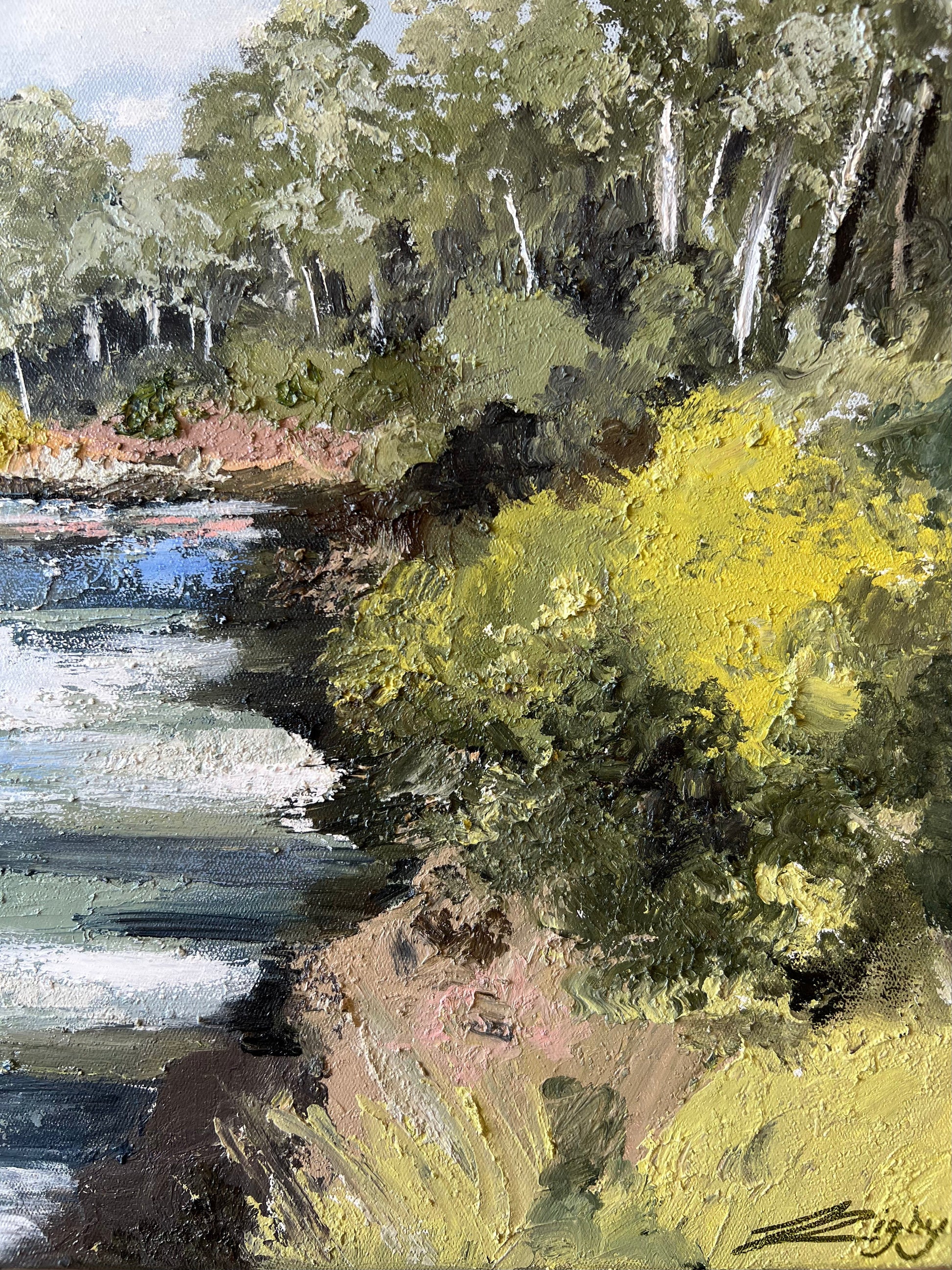 Warrandyte on the River, An impressionistic landscape painting depicting a river or shoreline with dense green and yellow foliage, dark tree trunks, and blue-gray water, with visible painterly brushstrokes throughout.