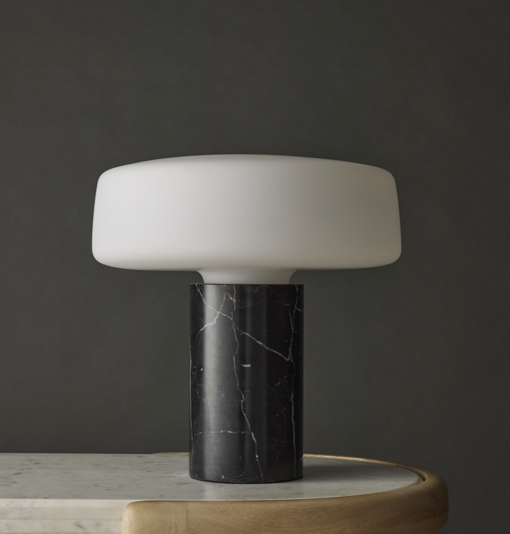 Nanouk Studio - Table lamp with white shade and black marble base on a dark background