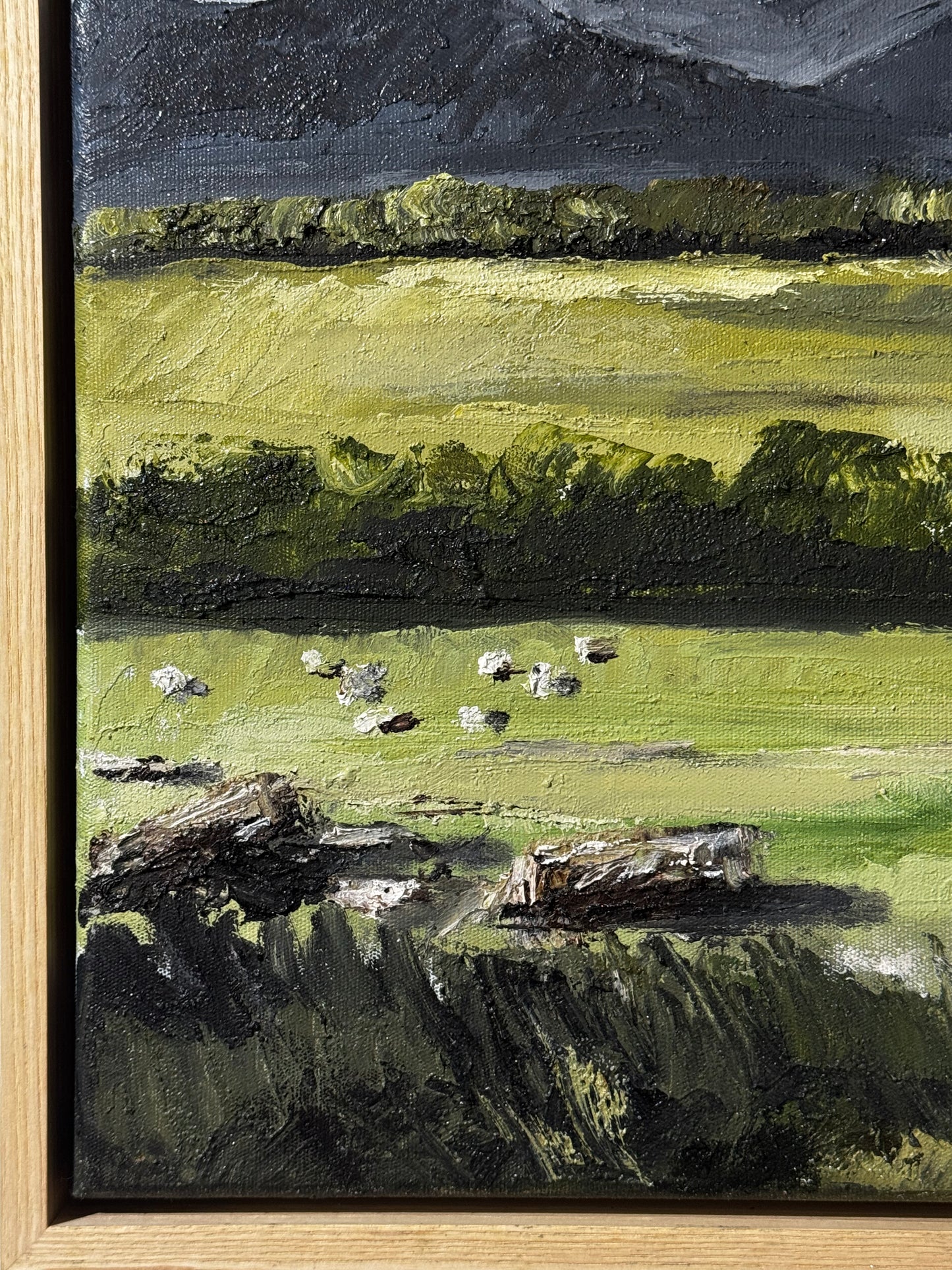 Painting of a landscape with green fields, trees, and a dark sky.