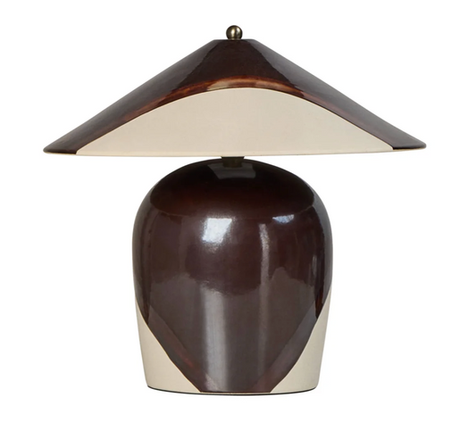 A modern table lamp with a glossy dark brown ceramic base and a matching conical shade featuring a cream-colored inner lining, set against a plain white background.
