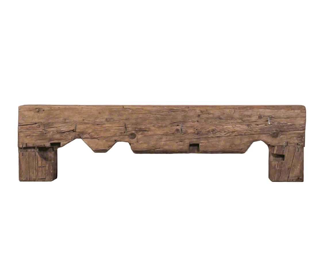 Wooden bench with rustic design on a gray floor and background
