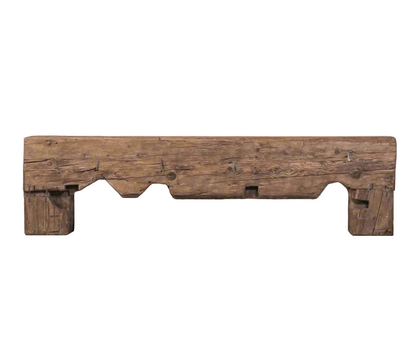 Wooden bench with rustic design on a gray floor and background