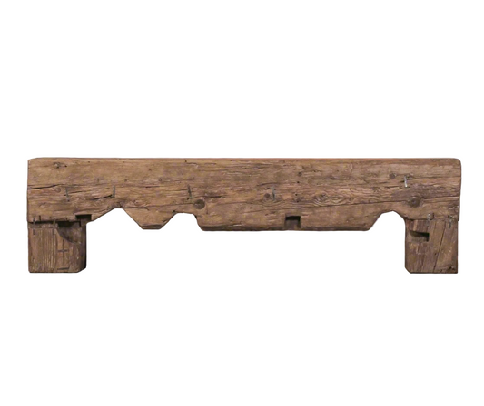 Wooden bench with rustic design on a gray floor and background