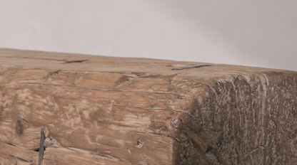 Close-up of a wooden surface with a natural, rustic texture.